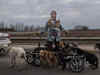 This image of woman rescuing disabled dogs in Ukraine is both poignant and hopeful