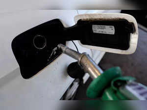 Car is filled with petrol at a filling station