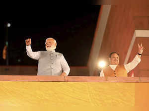 New Delhi: Prime Minister Narendra Modi with BJP President J P Nadda waves party...