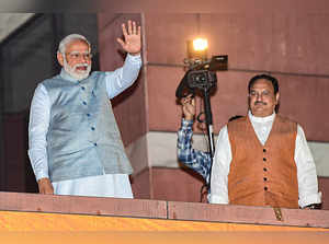 New Delhi: Prime Minister Narendra Modi with BJP President J P Nadda waves at pa...