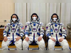 FILE PHOTO: The International Space Station crew members are pictured during space suit check at the Baikonur Cosmodrome