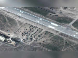 A satellite image shows deployment of ground forces near a runway, at Kherson Airfield