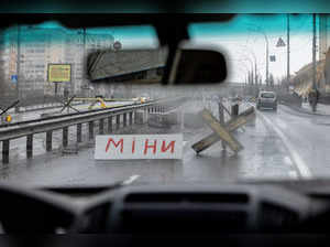 A sign in Ukrainian which reads “Mine” is seen at a roadblock as Russia's invasion of Ukraine continues, in Kyiv, Ukraine