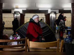 People shelter from possible air raids inside a metro station in Kyiv