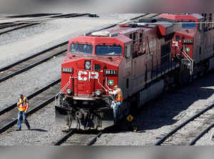 FILE PHOTO: A Canadian Pacific Railway crew works on their train at the CP Rail yards in Calgary