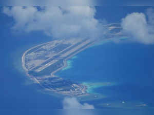 South China Sea : An airstrip made by China is seen beside structures and buildi...