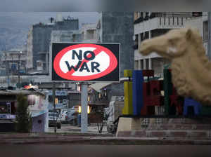 Electronic billboard reading "No war" is seen in in the rebel-held city of Azaz