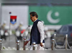 Islamabad : Pakistan's Prime Minister Imran Khan arrives to attend a military pa...