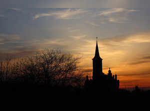 The sun sets behind the Church of Our Lady of Perpetual Help in Przemysl