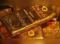 Gold flat as stronger dollar counters Ukraine worries