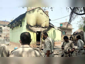 Birbhum, Mar 22 (ANI): Police personnel inspecting a burned house after a mob al...