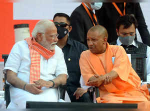 Lucknow: Prime Minister Narendra Modi with BJP leader Yogi Adityanath, during th...