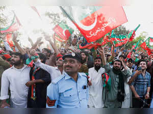 Supporters of Pakistani Prime Minister Imran Khan attend a public rally, in Islamabad