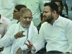 New Delhi: Loktantrik Janata Dal (LJD) leader Sharad Yadav with Rashtriya Janata...