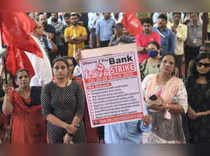 Mumbai: Bank employees shout slogans during  a protest in support of the two-day...