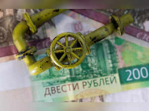FILE PHOTO: Illustration shows natural gas pipeline, Russian Rouble banknotes