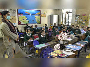 New Delhi: Students attend a class after schools reopened for nursery to VIII st...