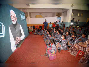 Patna: School students watch a broadcast of Prime Minister Narendra Modi's addre...