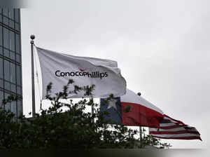 Flags fly outside ConocoPhillips offices in Houston