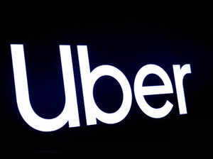 A screen displays the company logo for Uber Technologies Inc in 2019