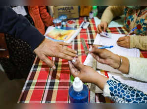 Pathankot: A voter gets his finger inked as he votes for Punjab Assembly electio...