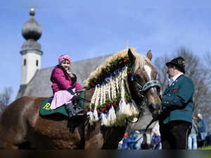 A participant rides a horse during the traditional Easter Monday riding procession "Georgi ride" in Traunstein