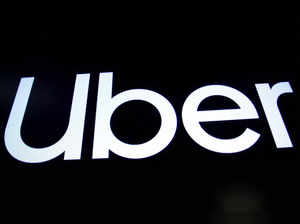 A screen displays the company logo for Uber Technologies Inc. on the day of it's IPO at the NYSE in New York