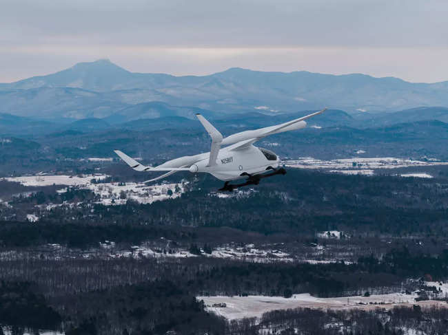 Alia, an experimental electric vertical aircraft built by Beta, an aviation tech startup, flies over Burlington.