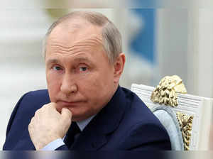 Russian President Vladimir Putin listens during a meeting of the Russia ...