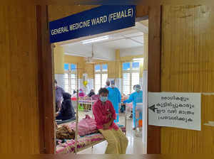 A man looks out from a COVID-19 ward in the Government Medical College Hospital in Manjeri