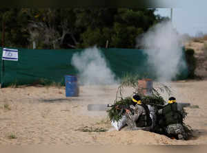 Palestinian militants take part in an anti-Israel military exercise in southern Gaza