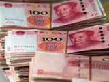 China lowers banks' FX reserve ratio to counter falling yuan