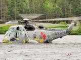 Prince William heads toward a Sea King helicopter