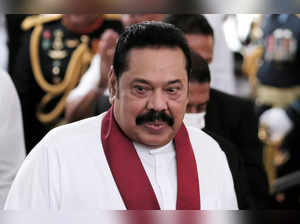 Sri Lanka's Prime Minister Mahinda Rajapaksa reacts during his swearing in ceremony as the new Prime Minister, at Kelaniya Buddhist temple in Colombo