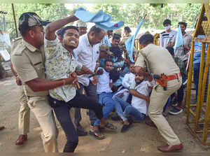 Bengaluru: Police personnel detain members of Campus Front of India during their...