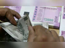 Rupee surges 18 paise to close at 76.43 against US dollar