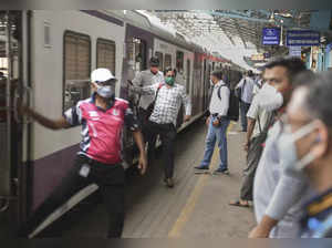 Passengers arrive by a local train