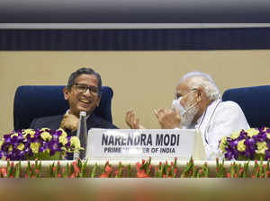 Prime Minister Narendra Modi with Chief Justice of India N. V. Ramana...