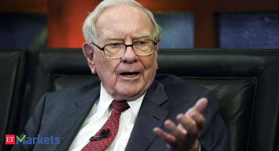 Warren Buffett reveals big investments, rails against Wall St excess at Berkshire meeting