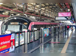 New Delhi: Commuters board a special driverless train on the Delhi Metro Pink Li...