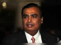 FILE PHOTO: Mukesh Ambani, Chairman and Managing Director of Reliance Industries, arrives to address the company's annual general meeting in Mumbai