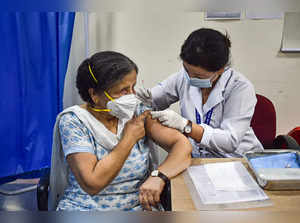New Delhi: A health worker administers a dose of COVID-19 preventive vaccine to ...