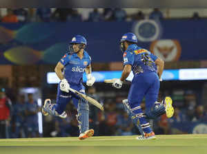 Mumbai: Ishan Kishan and Rohit Sharma, captain of Mumbai Indians take a run duri...
