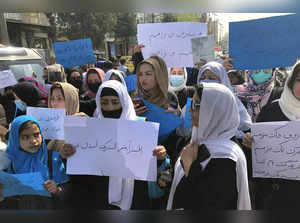 Kabul : Afghan women chant and hold signs of protest during a demonstration in K...