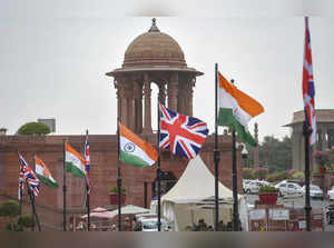 New Delhi: National flags of United Kingdom and India put up at Rajpath, during ...