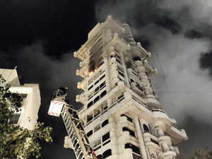Mumbai: Smoke billows after a fire broke out in a high-rise building at Bandra, ...