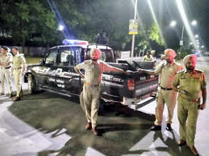 Mohali: Police personnel cordon off the area after a blast outside the Punjab Po...