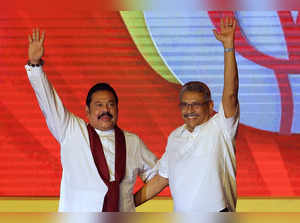 Colombo:  Mahinda Rajapaksa, left, and his brother Gotabaya Rajapaksa wave to su...