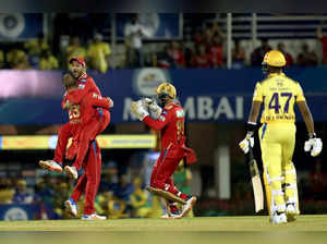 Mumbai: Liam Livingstone of Punjab Kings celebrates with team captain Mayank Aga...