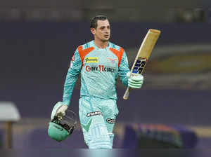 Mumbai: Quinton De Kock of Lucknow Super Giants raises his bat to celebrate his ...
